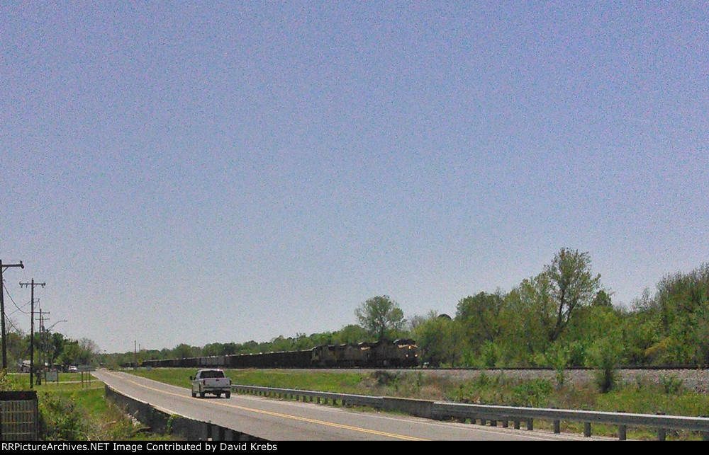 NB ballast train eases uphill to a stop.